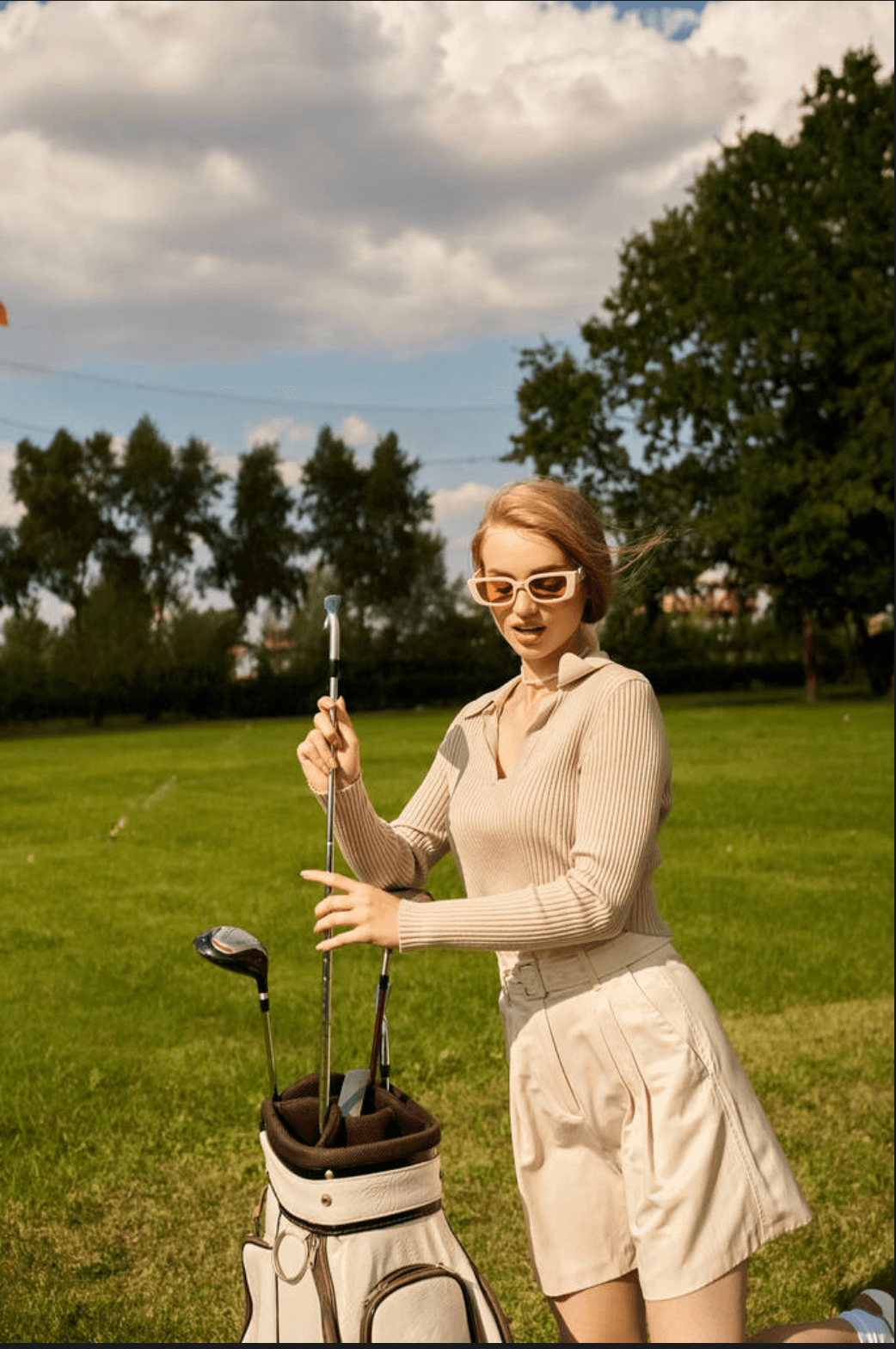 Woman with golf clubs